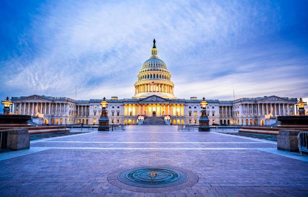 The Capitol Building in Washington, D.C., USA lit up in the early evening.